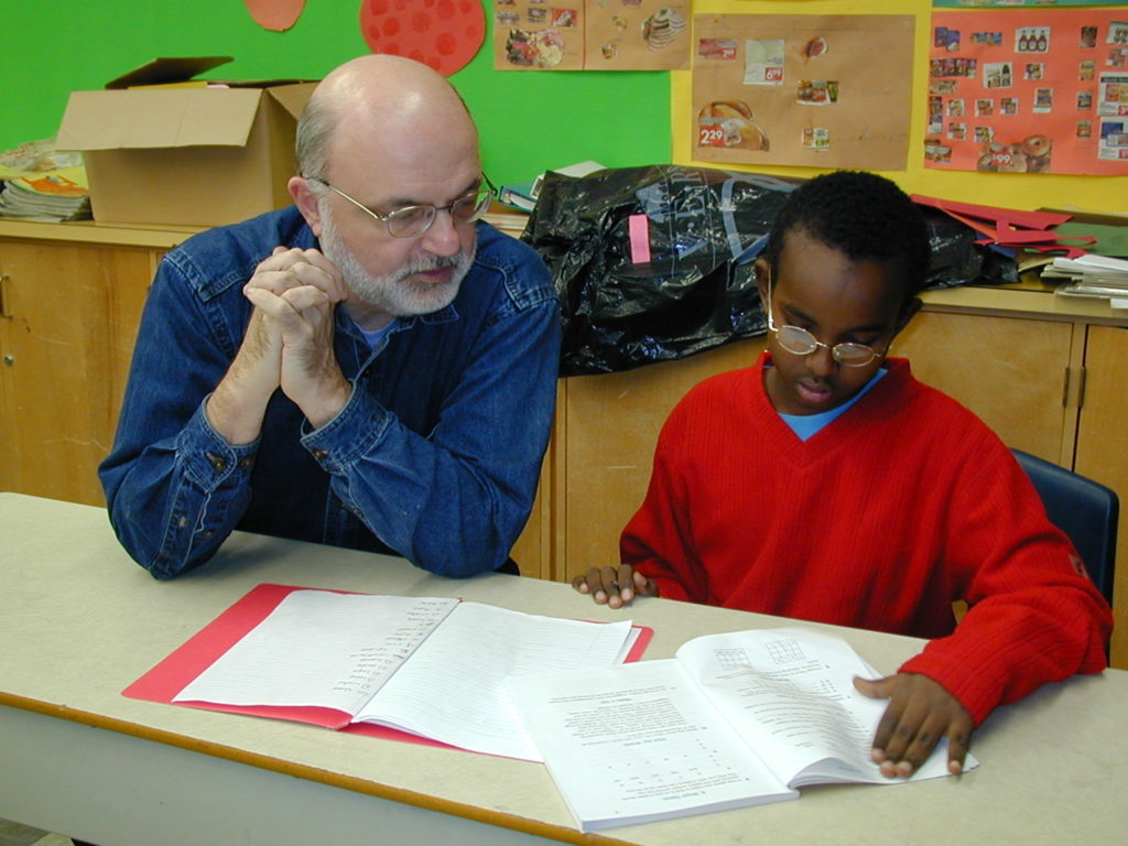 John Daniel O'Leary Reading with a student at a Frontier College reading event.