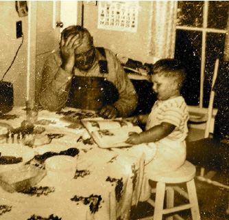 photo of Yeiter reading to his grandfather (age 5)